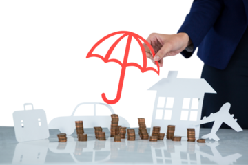 Businesswoman protecting her wealth with umbrella