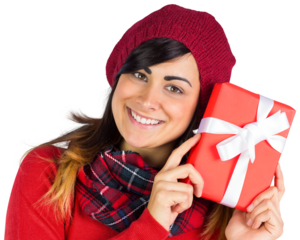 Smiling brunette in red hat holding gift