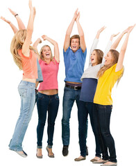 Obraz premium Group of friends cheering as they jump in the air and look at one another
