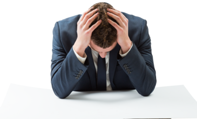 Businessman with head in hands