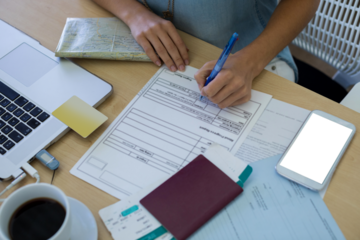 Female executive filling form at her desk