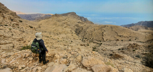 Trekking in the arid Eastern Hajar Mountains, Wadi Bani Khalid, Oman