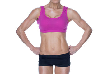 Female bodybuilder posing in pink sports bra and shorts mid section