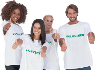 Happy group of volunteers giving thumbs up