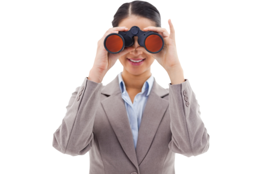 Businesswoman looking through binoculars