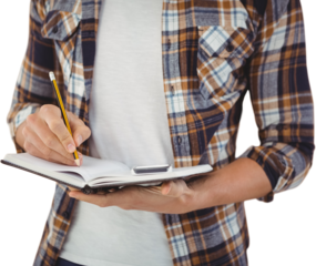 Mid section of hipster writing with pencil on book