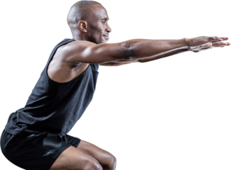 Side view of sportsman squatting