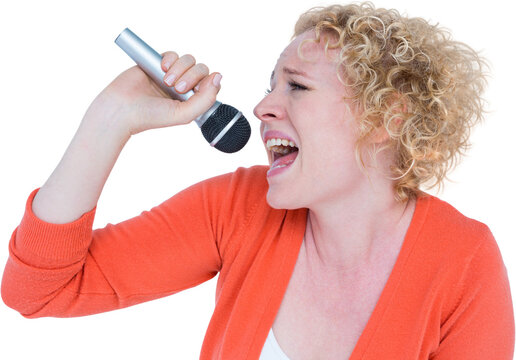 Attractive woman singing in microphone