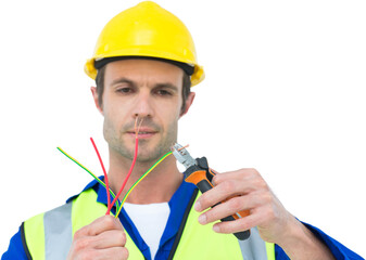 Handsome electrician cutting wire with pliers