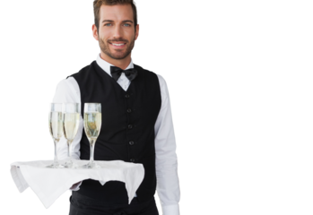 Handsome smiling waiter holding tray of champagne 