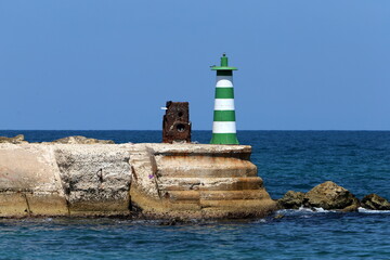 A lighthouse is a navigational landmark that is used to identify coasts and locate ships.