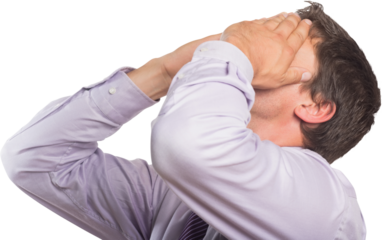 Worried businessman with hands covering face