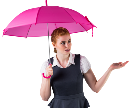 Pretty redhead businesswoman holding umbrella