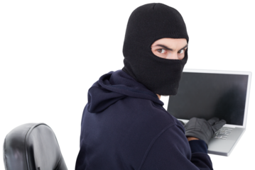 Hacker sitting and hacking laptop 