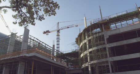 Fototapeta premium Crane and building at construction site