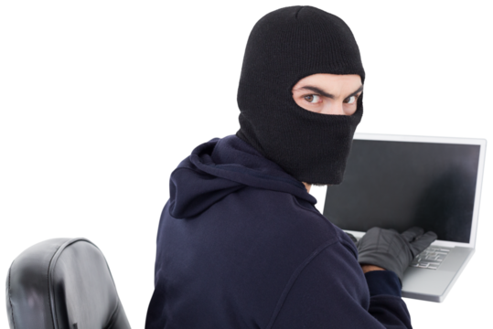 Hacker sitting and hacking laptop 