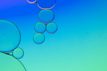 Macro close up of water bubbles with copy space over blue and green background