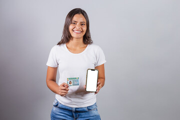 Brazilian woman, with driver's license, CNH, document. Smartphone, white screen for advertisements.