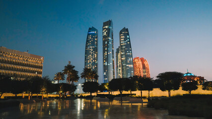 A city skyline with the lights on