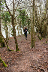 Young woman in sportswear hiking in the Basque Country