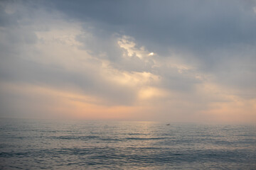 Fototapeta na wymiar Sunset on the sea, sky with clouds, summer.