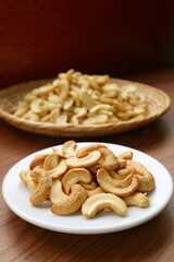 Plate of Delectable Roasted Cashew Nut with Blurry Dried Kernel in the Backdrop
