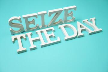 Seize The Day alphabet letters on blue background