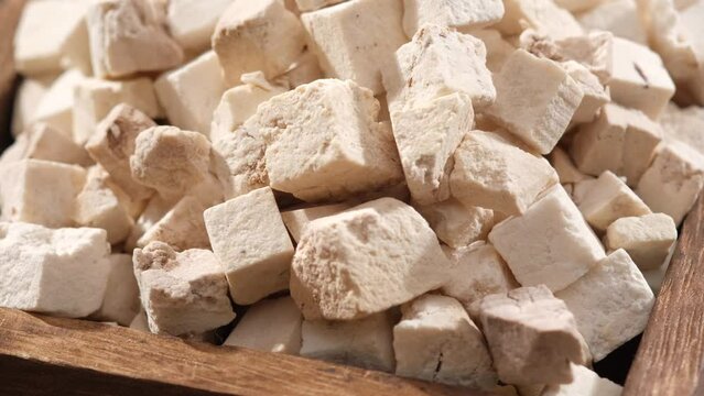 Poria cocos with closeup angle. Poria cocos (Wolfiporia extensa) is a treatment for numerous health conditions, especially Alzheimer's disease, cancer, and diabetes.