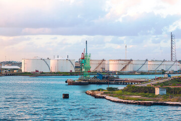 Naklejka premium Oil harbor. Refinery and oil storage on the shore of the Gulf of Curacao, Dutch Antilles.