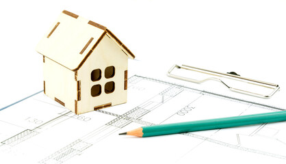 keys and the layout of the house on the drawings. the concept of buying and building housing