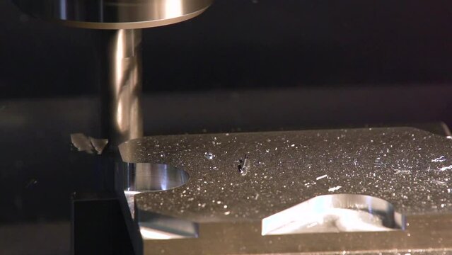 modern 5 axis drilling machine working on steel part