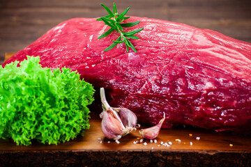 Fresh raw beef sirloin on cutting board
