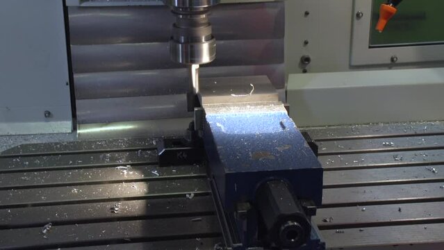 modern 5 axis drilling machine working on steel part