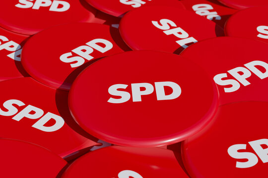 SPD - Social Democratic Party of Germany. Some political badges, campaign button on the table. SPD, social democratic party, part of the german government. 3D illustration 