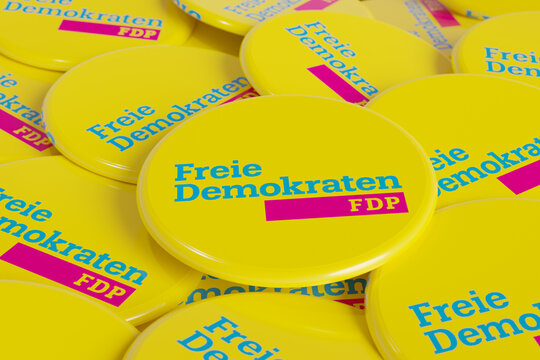 FDP - Free Democratic Party. Some political badges, campaign button on the table. FDP, free democratic party, part of the german government, liberal party. 3D illustration