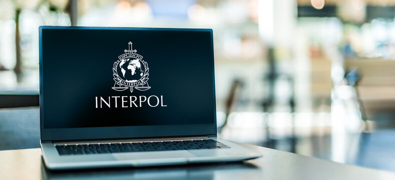 Laptop computer displaying logo of Interpol
