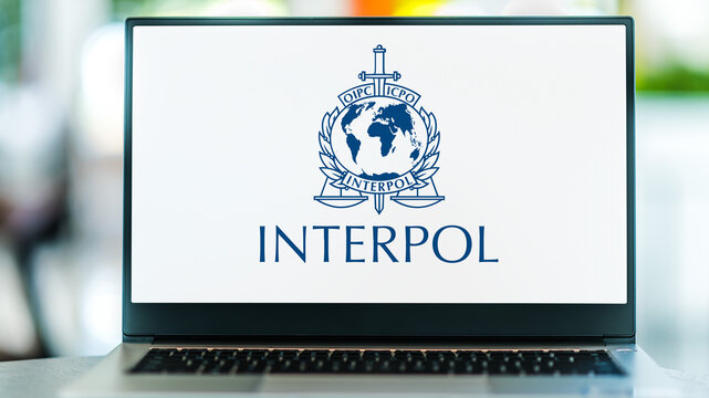 Laptop computer displaying logo of Interpol