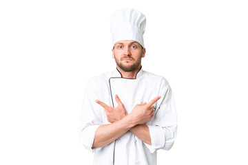 Young caucasian chef over isolated chroma key background pointing to the laterals having doubts