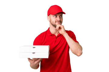 Pizza delivery man with work uniform picking up pizza boxes over isolated chroma key background and looking up