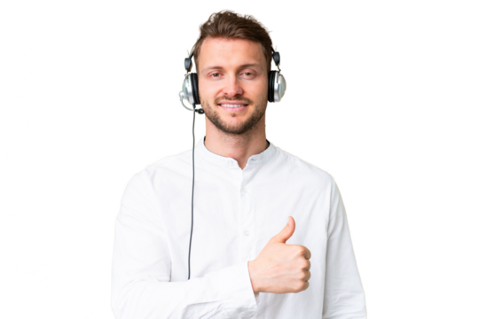 Telemarketer caucasian man working with a headset over isolated chroma key background giving a thumbs up gesture
