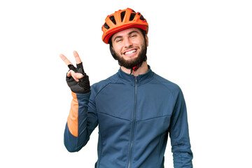 Young cyclist man over isolated chroma key background smiling and showing victory sign - obrazy, fototapety, plakaty