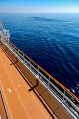 Outdoor jogging running walking track on deck of luxury cruiseship cruise ship liner with ocean...