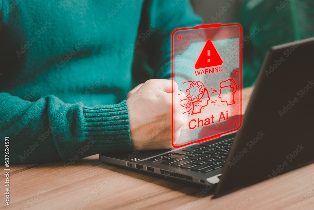Leinwandbilder Young man using laptop chatting with a smart AI using an artificial intelligence chatbot with triangle caution warning sign for notification error concept. Chat with AI, Artificial Intelligence.