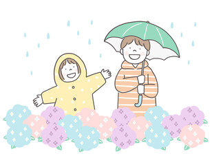 雨の日に傘をさす子供たちと紫陽花