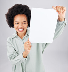 Portrait, poster and mockup with a woman holding blank paper in studio on a gray background for...