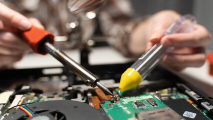 the master solders the computer chip