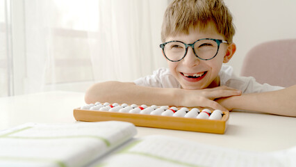 the boy is engaged in mental arithmetic on the accounts