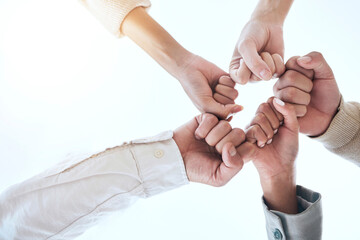 Below business people, fist bump and circle for team building, support and group goals in...
