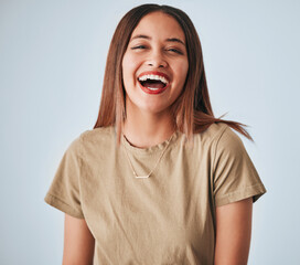 Obraz na płótnie Canvas Happy, laughing and portrait of a cheerful woman isolated on a white background in studio. Smile, funny and a beautiful young girl with happiness, smiling and positivity on a backdrop for expression