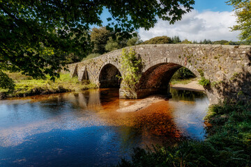 Fototapeta na wymiar Old stone bridge, Two Bridges, Dartmoor, Devon, England